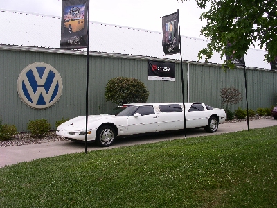 [White stretch corvette with four doors. Normally a corvette only has two doors.]
